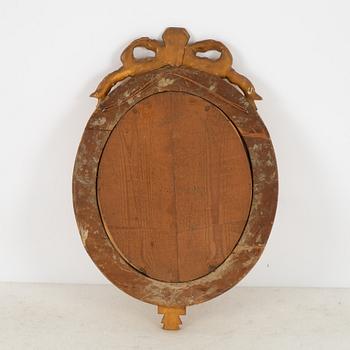 A Gustavian giltwood one-branch girandole mirror, Stockholm, late 18th century.