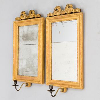 A pair of mirrored wall sconces from the latter half of the 20th century.