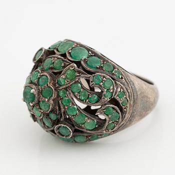 Silver ring with green stones.