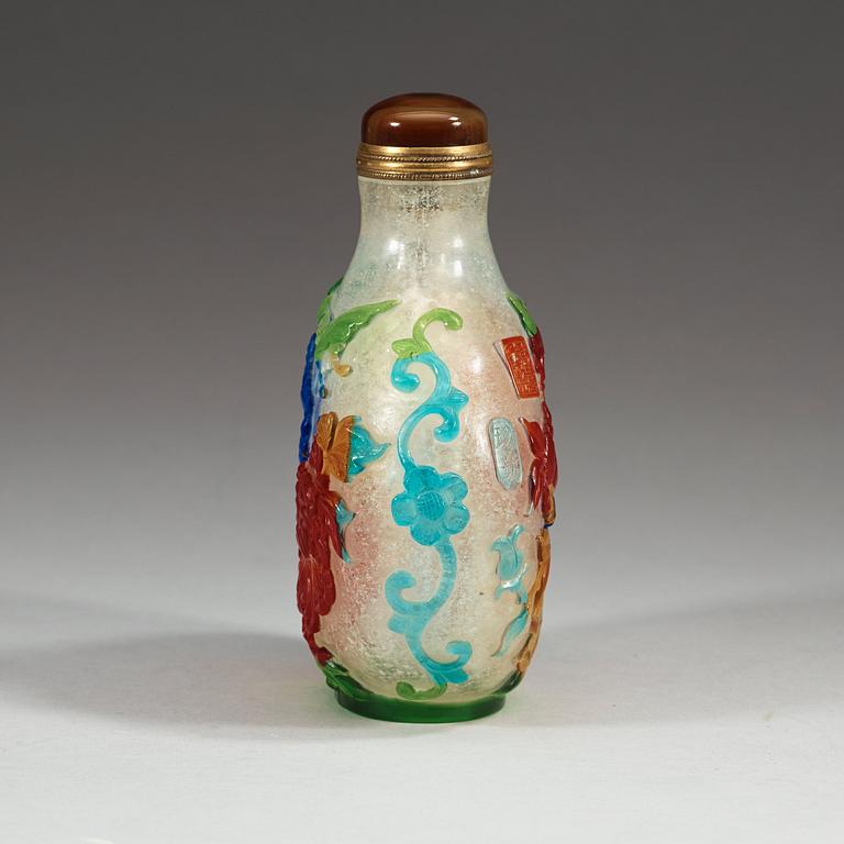 A large Chinese Peking glass snuff bottle with stopper, seal mark to shoulder.