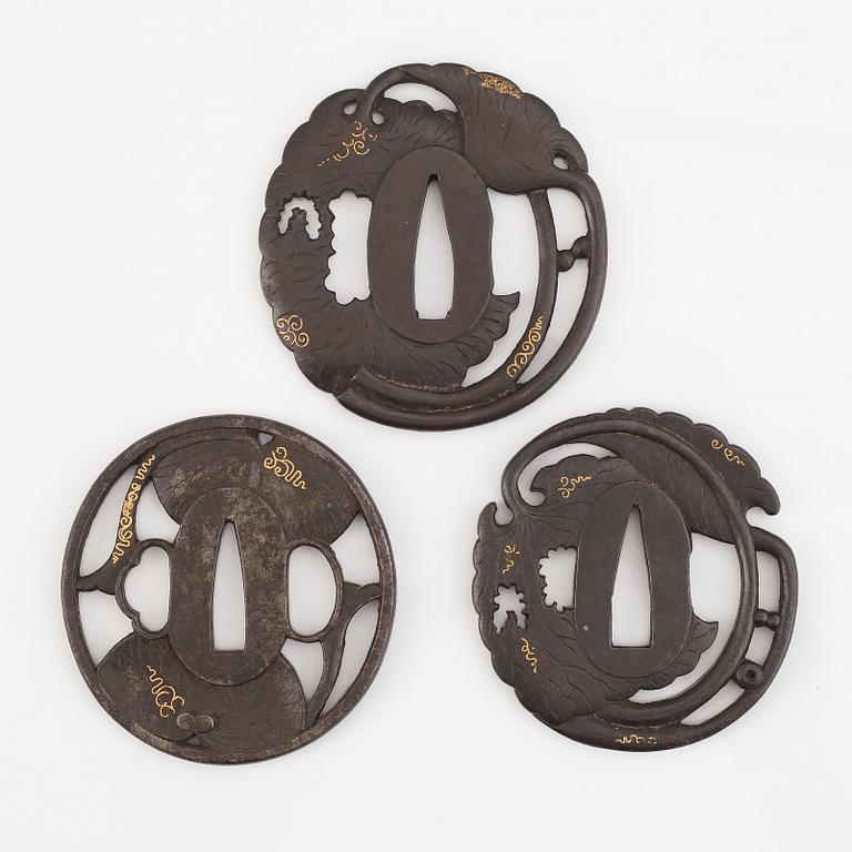 Three iron tsuba with gold inlay, two signed, Edo period.