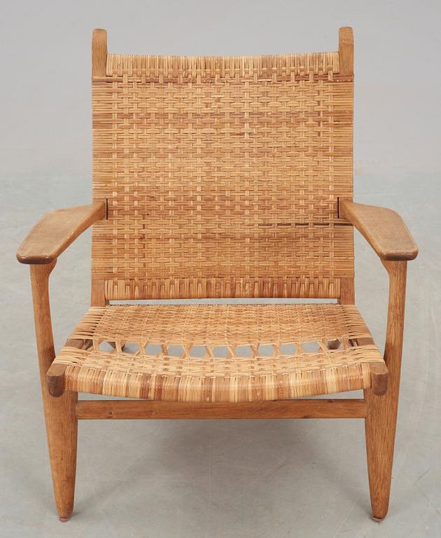 A Hans J Wegner 'CH-27' oak and rattan armchair, Carl Hansen & Son, Denmark 1950's-60's.