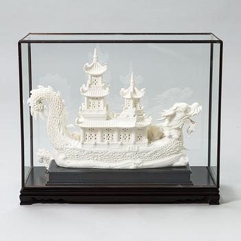 An oriental Boat sculpture in porcelain.