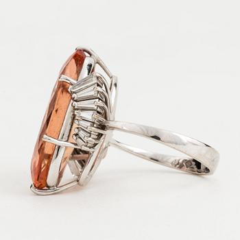 A topaz and diamond cocktail ring.