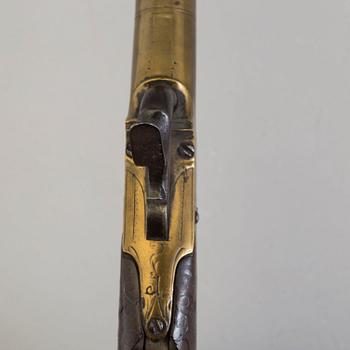 A secon half of the 19th century pair of Queen Anne brass percussion pistols converted from flintlock by Brueton, London.