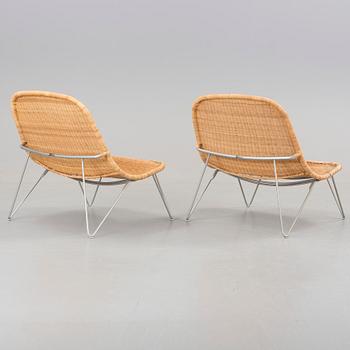 a pair of 21h Century lounge chairs designed by James Irvine, by IKEA.