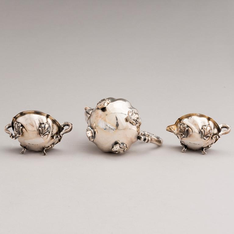 A silver sugar tong and a 3-piece silver coffee set, mark of Juho H. Pekuri, Oulu 1931 and Finnish import marks 1938.