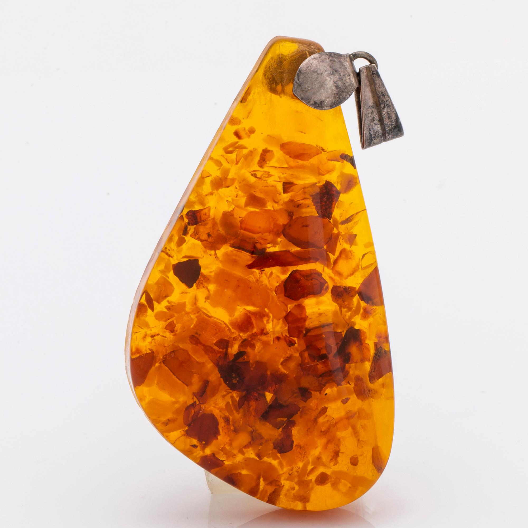 Amber set in silver, pendant, ring and earrings.