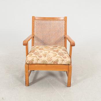 A 1940/50s rattan armchair.