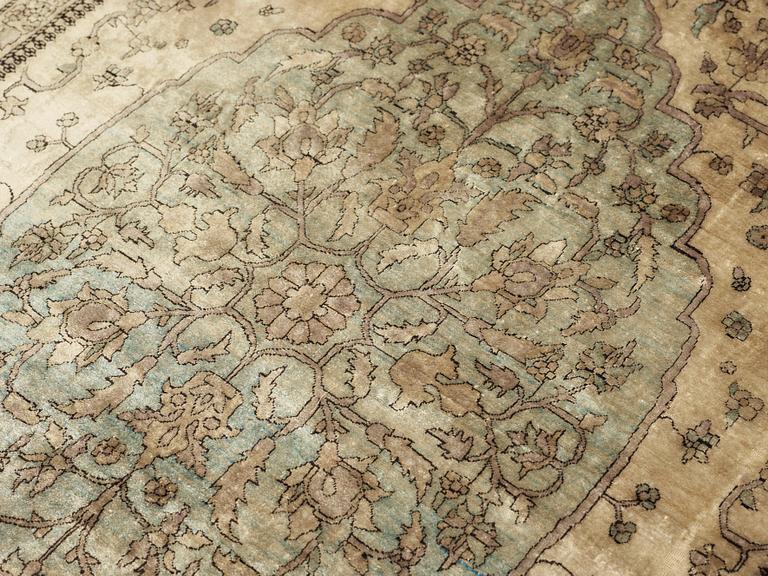 A CARPET, an antique silk Kashan/Tabriz (possibly a Kashan  Motachem), ca 199 x 126,5 cm.