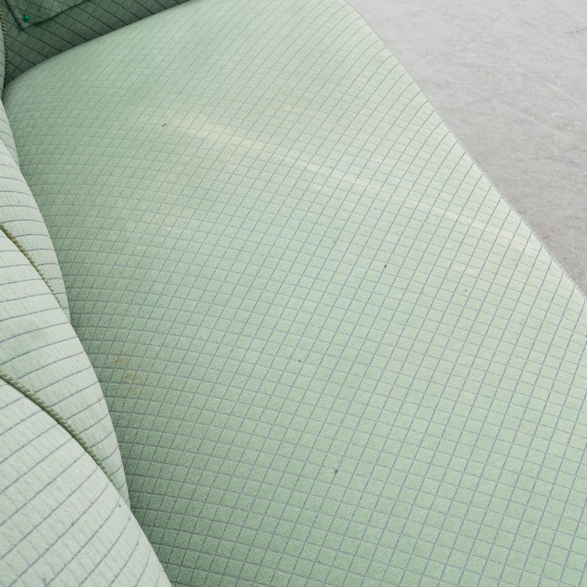 A mid 20th Century sofa and easy chair.