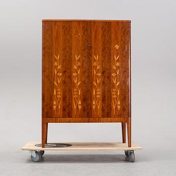 A 1940's Swedish Modern mahogany cabinet from Möbelbolaget.