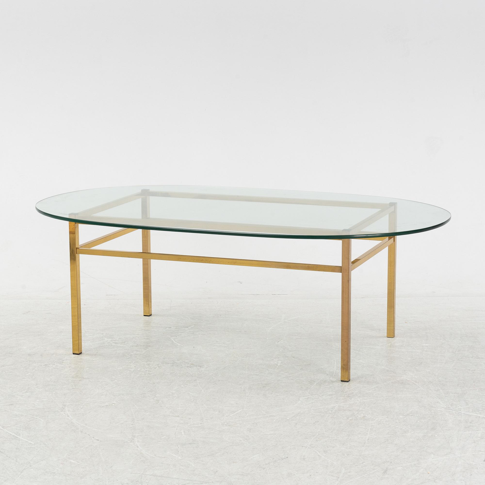 A glass and brass coffee table, Engelsson, Sweden, 21st century.
