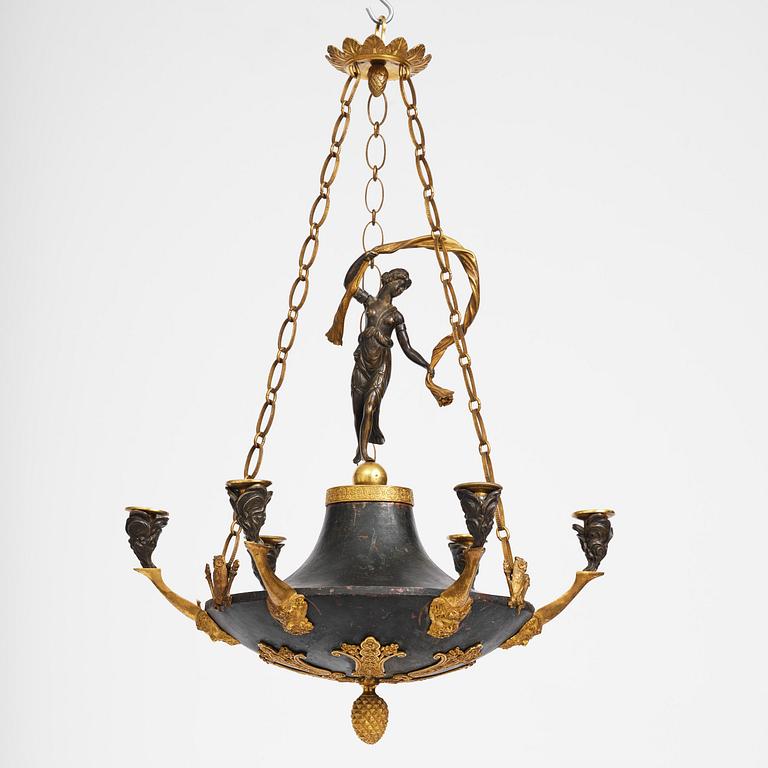 A patinated and ormolu six-light Empire chandelier, Stockholm, first part 19th century.