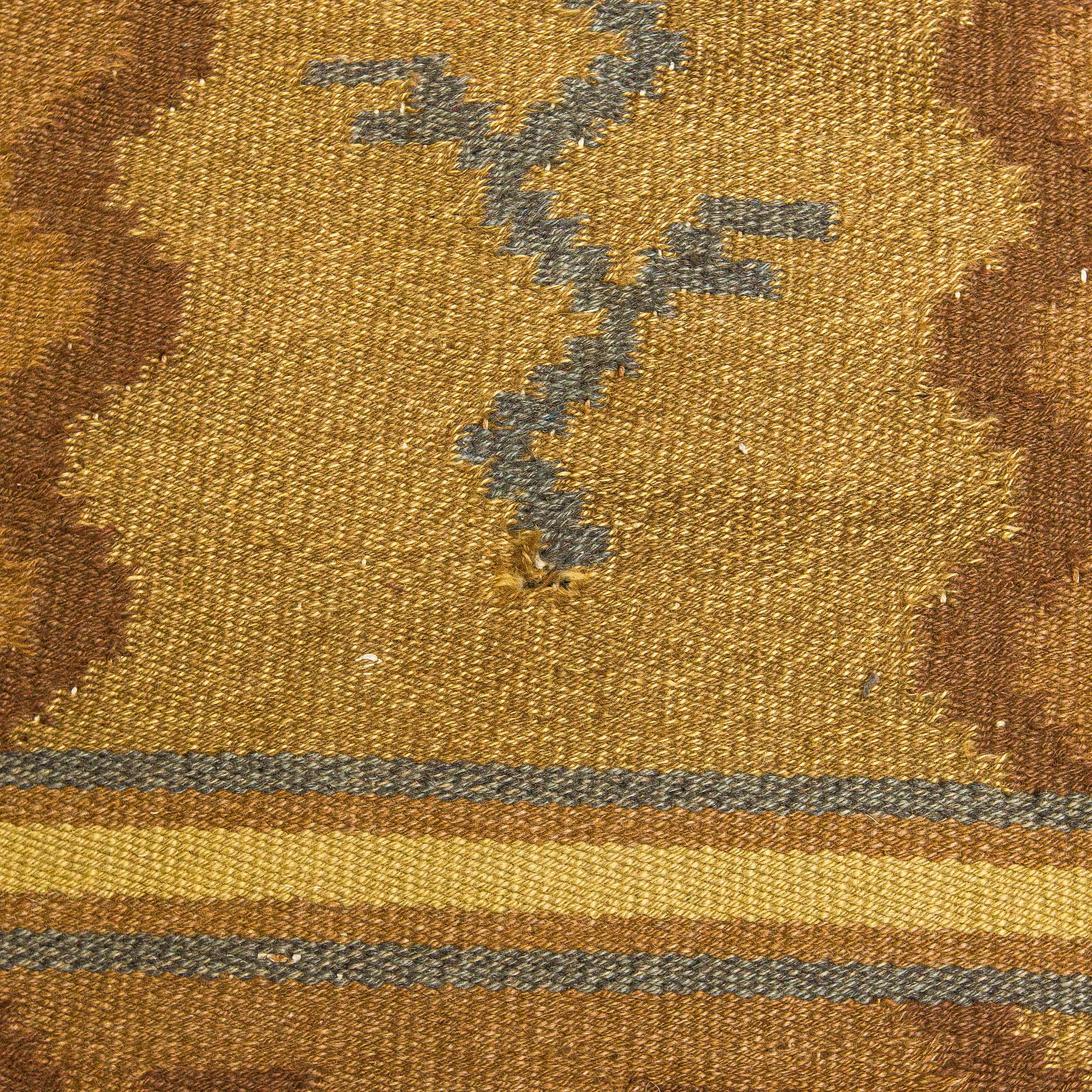 Aino Keinänen-Baeckmann, A 1920s Finnish flat weave carpet. Circa 300 x 203 cm.