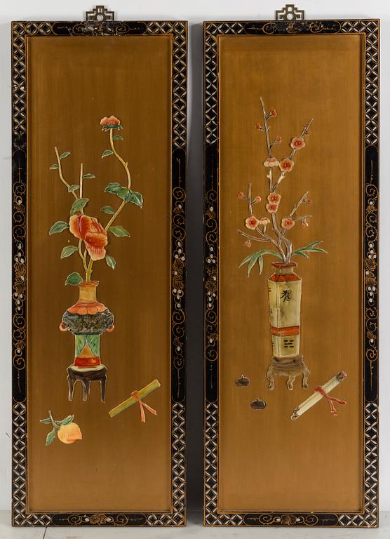 A pair of Chinese wooden panels with stone inlays.
