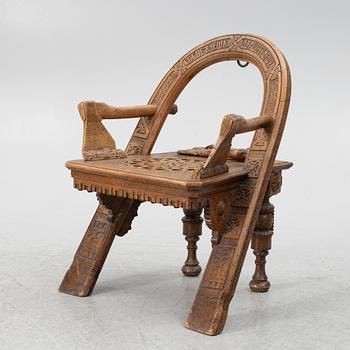 Armchair, after a design by Vasily Shutov called 'Arc, Axes and Mittens' Russia late 19th century.