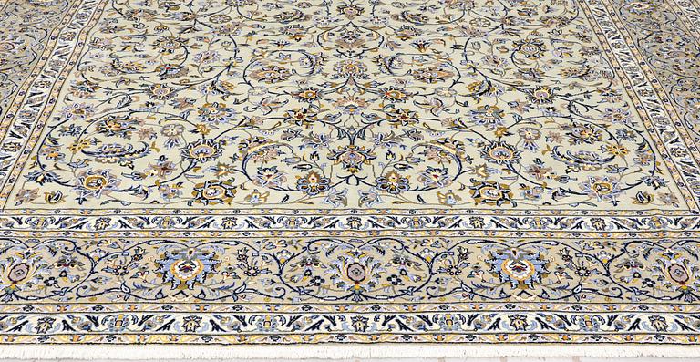 A Keshan carpet, signed, 397 x 302 cm.