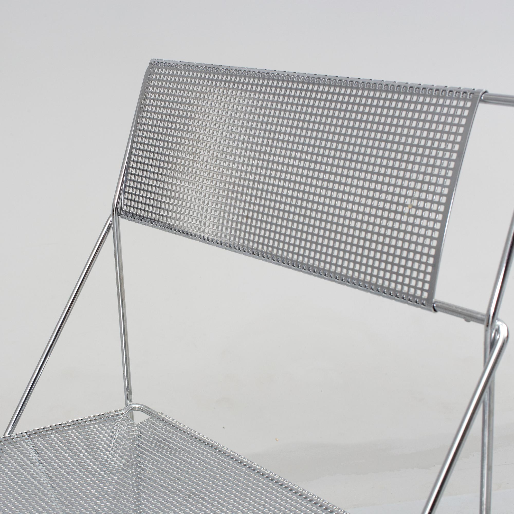 8 contemporary stackable metal chairs.