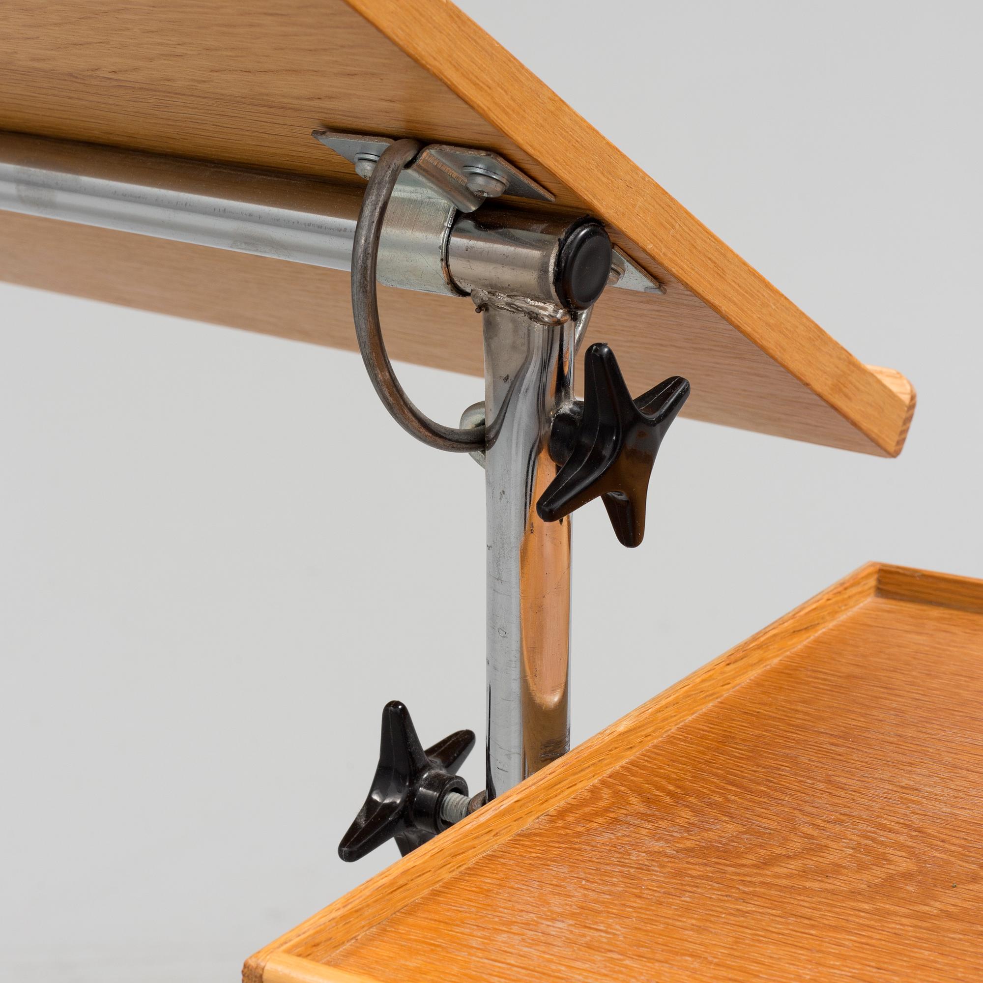 A teak reading table, second half of the 20th Century.