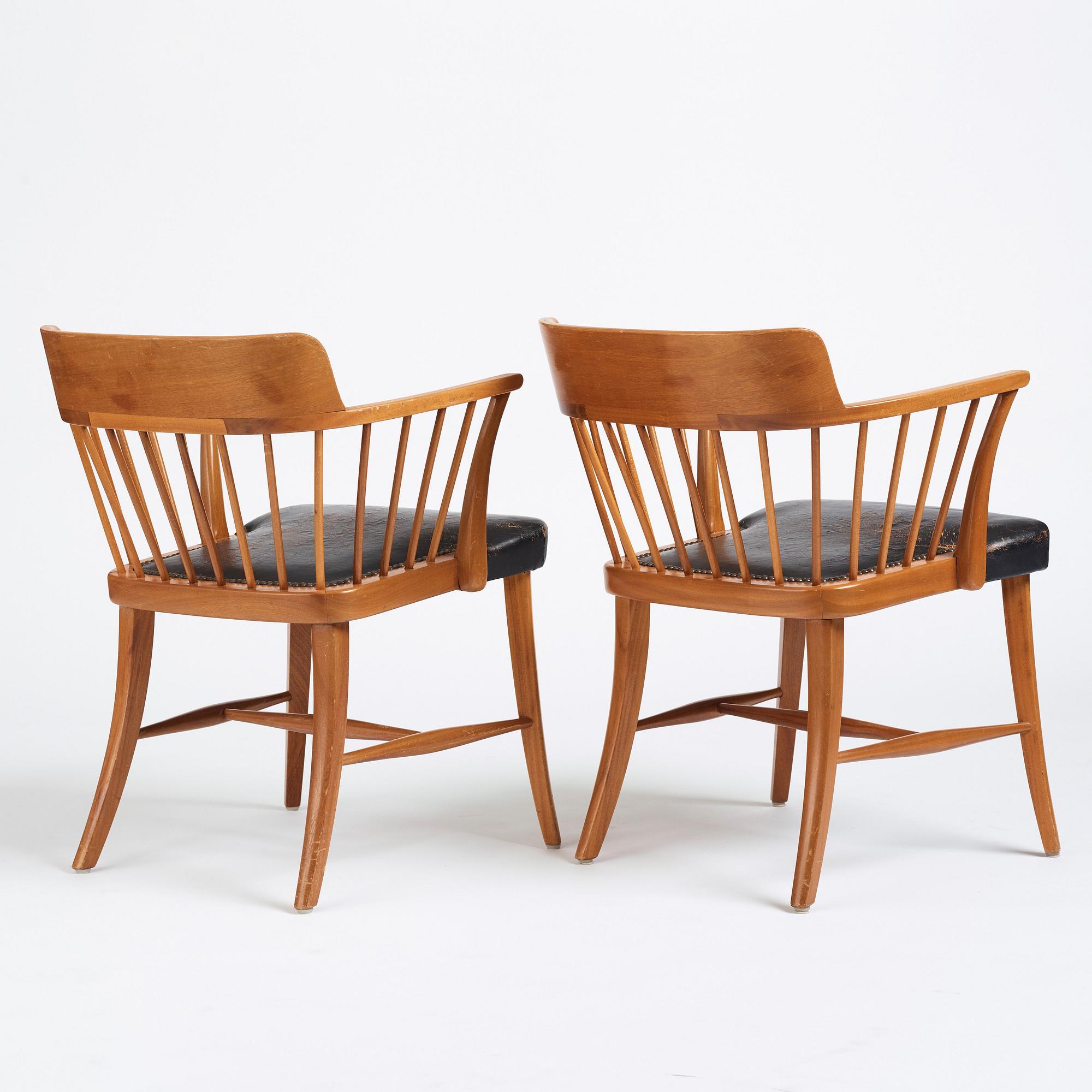 Josef Frank, a pair of mahogany and black leather 'Captain's chair', Svenskt Tenn, model 789B, acquired in 1950.