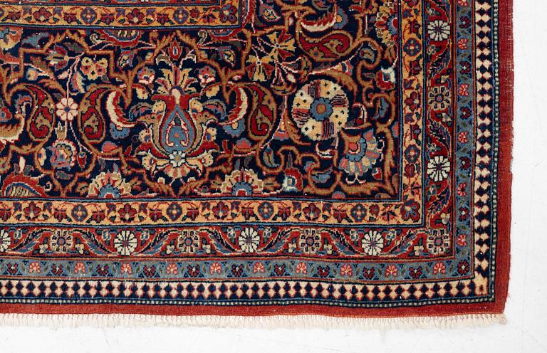 An antique Kashan Dabir carpet, c. 404 x 312 cm.