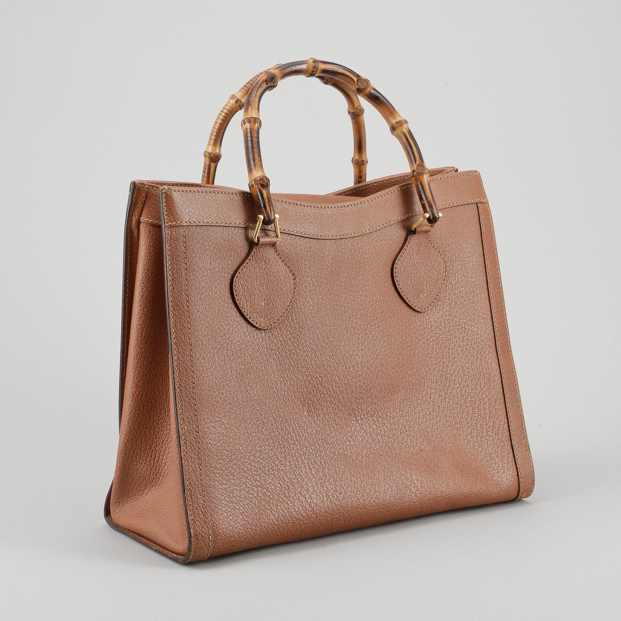 GUCCI, a brown leather imitaion handbag with bamboo handles.