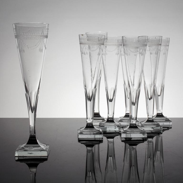 A set of 8 early 19th century champagne glasses.