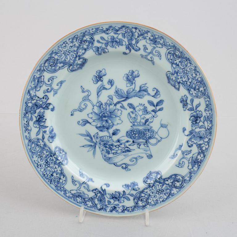 A group of four blue and white dishes and a cabaret piece, Qing dynasty, 18th century.