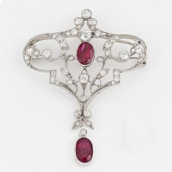 An old-cut diamond and ruby brooch.