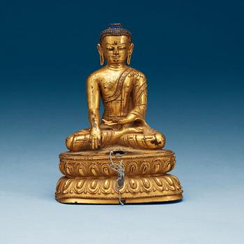 A gilt bronze figure of Buddha, Qing dynasty (1644-1911).