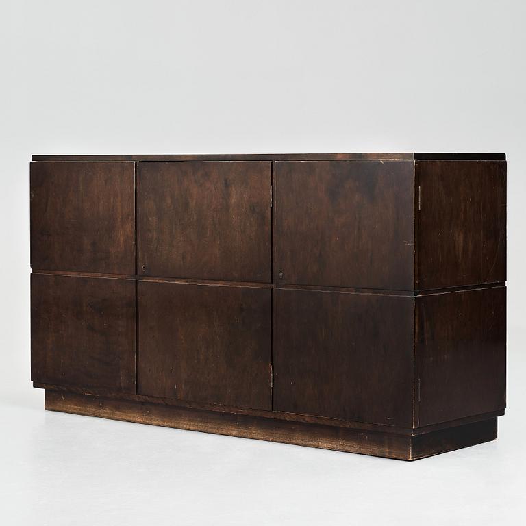 Axel Einar Hjorth, a darkly stained birch sideboard,"Typenko", Nordiska Kompaniet, Sweden 1932.