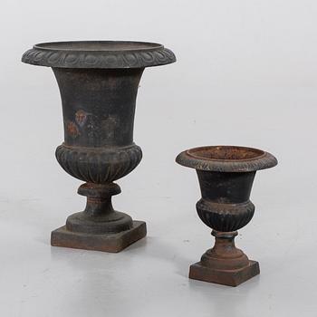 A set of two cast iron garden urns, 20th century.