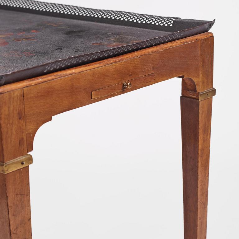 A late Gustavian tôle-peinte and mahogany tray-table from the workshop of Georg Haupt, Stockholm, late 18th century.