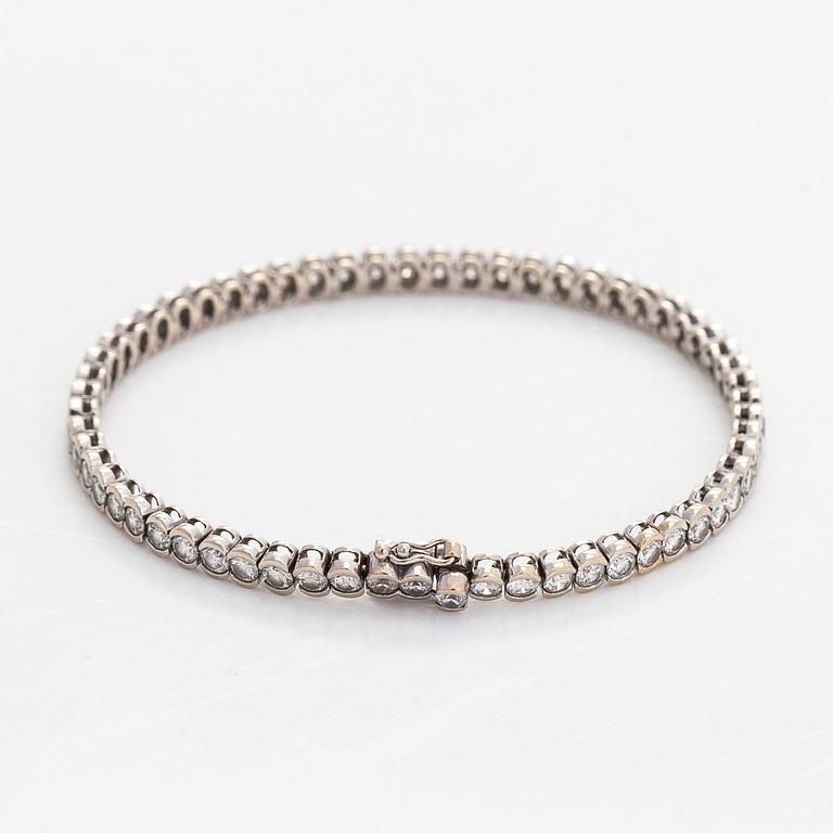 Tennisrannekoru, 18K valkokultaa, briljanttihiottuja timantteja.