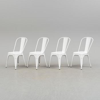 A set of four Tolix chairs.