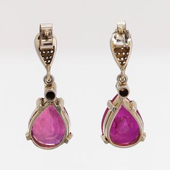 A pair of gilded sterling silver earrings with rubies, rose and brilliant cut diamonds.