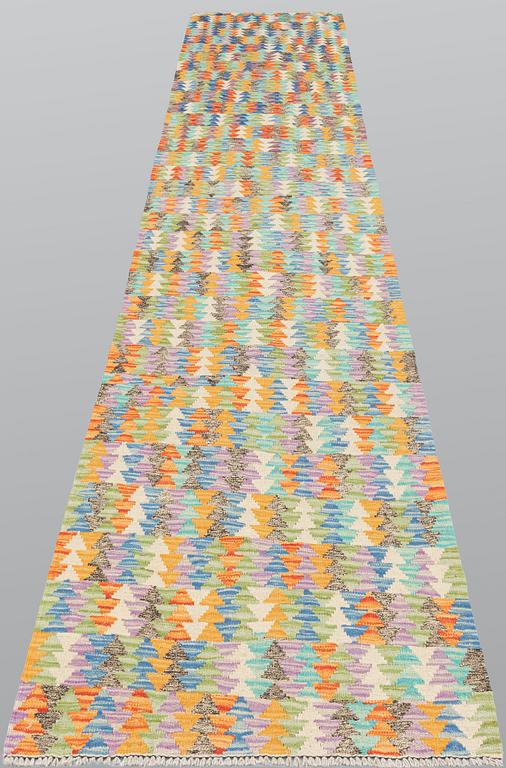 A runner, kilim, ca 391 x 80 cm.