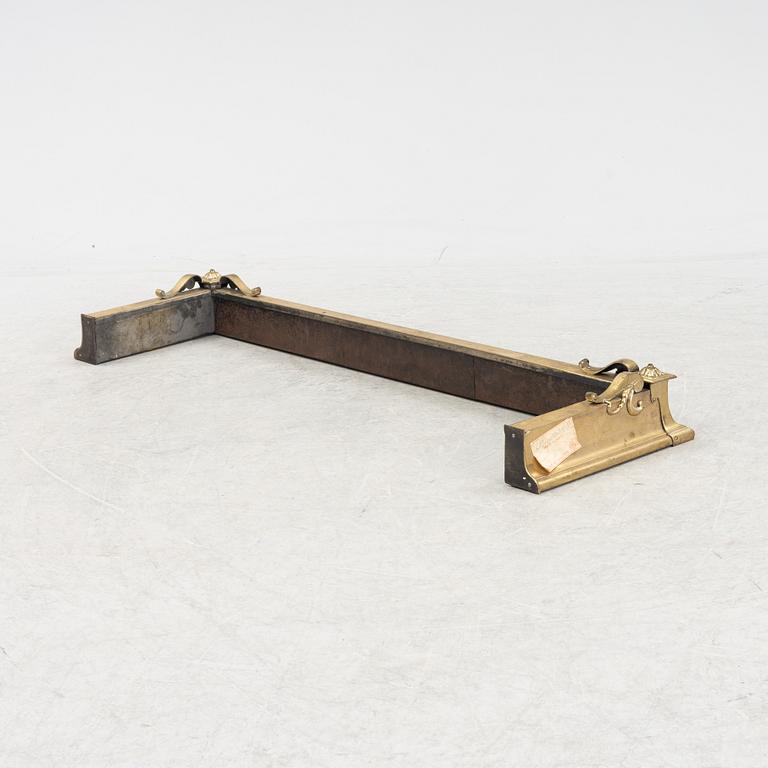 A brass fire guard, around 1900.