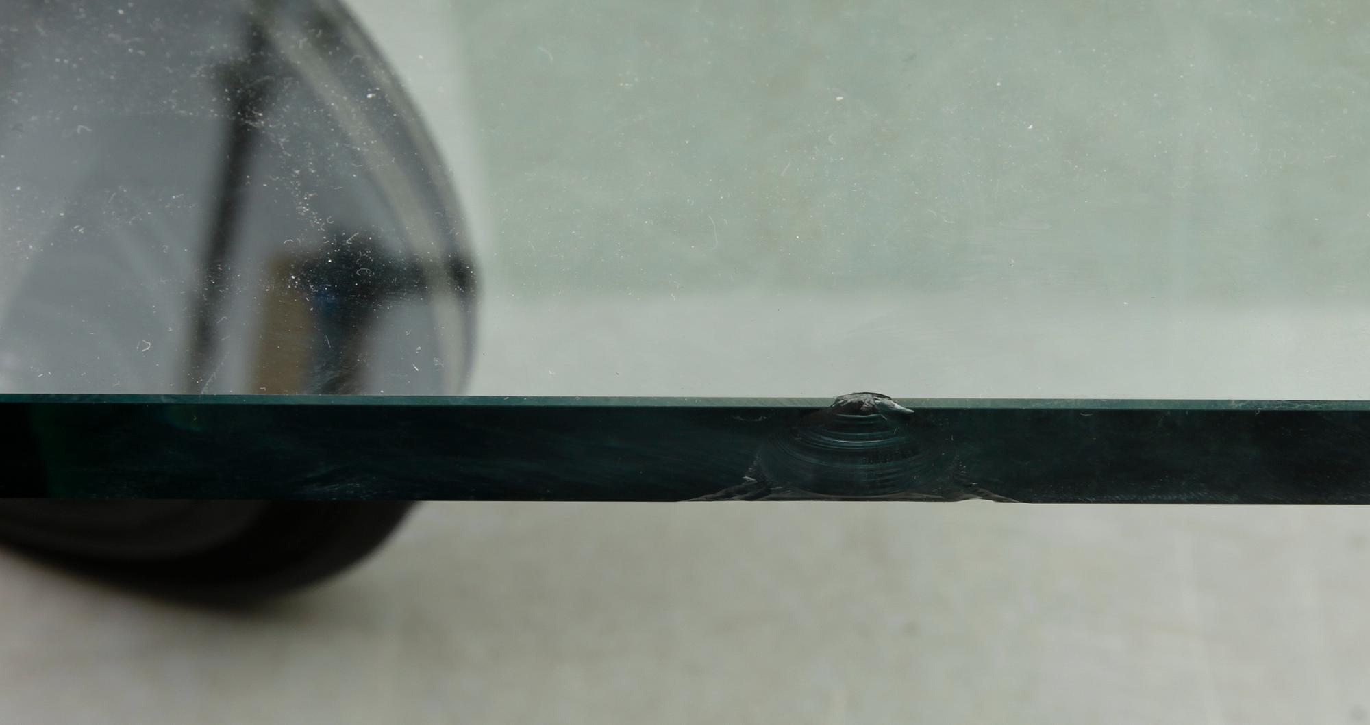 A Gae Aulenti 'Tavola con Ruote' table, Fontana Arte, Italy.