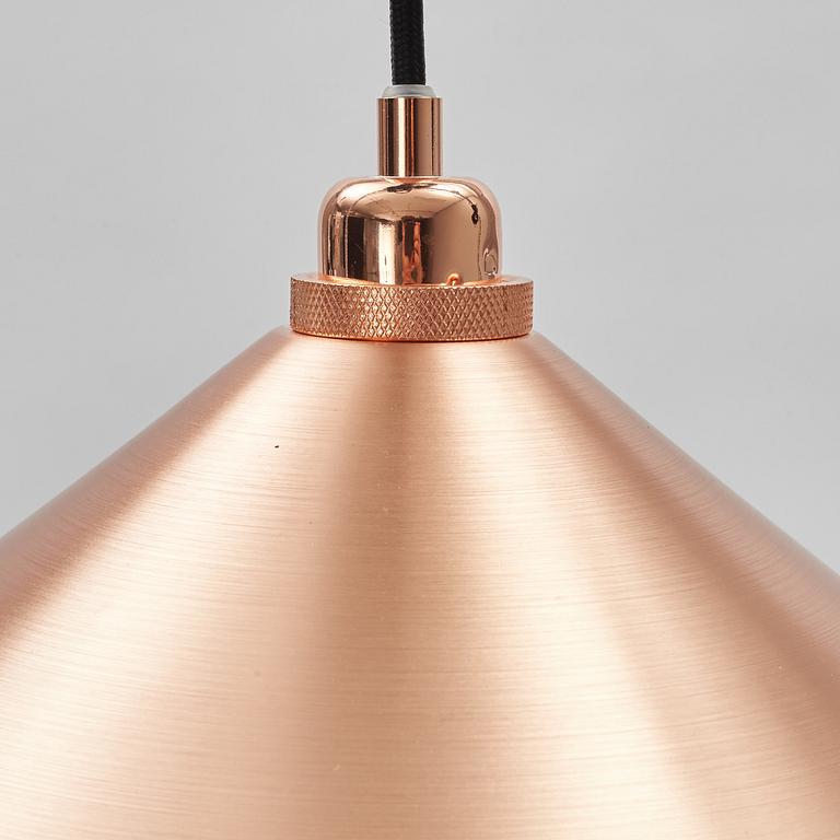 A pair of Frama Shade 360 ceiling lamps.