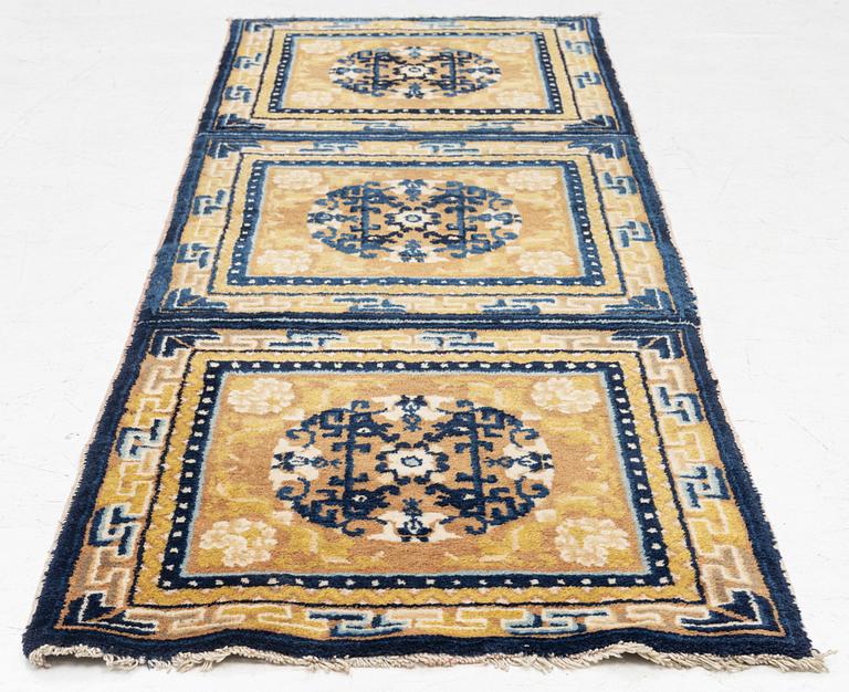 An antique Ningxia meditation rug, north west China, c 189 x 63 cm.