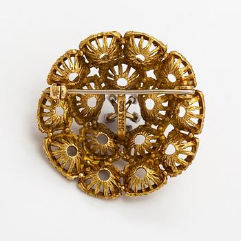 An 18Kgold brooch with diamonds ca. 0.16 ct in total.