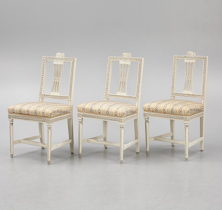 A sofa, three chairs and a table, Gustaivan style and of the Gustavian period, 19th-20th century.