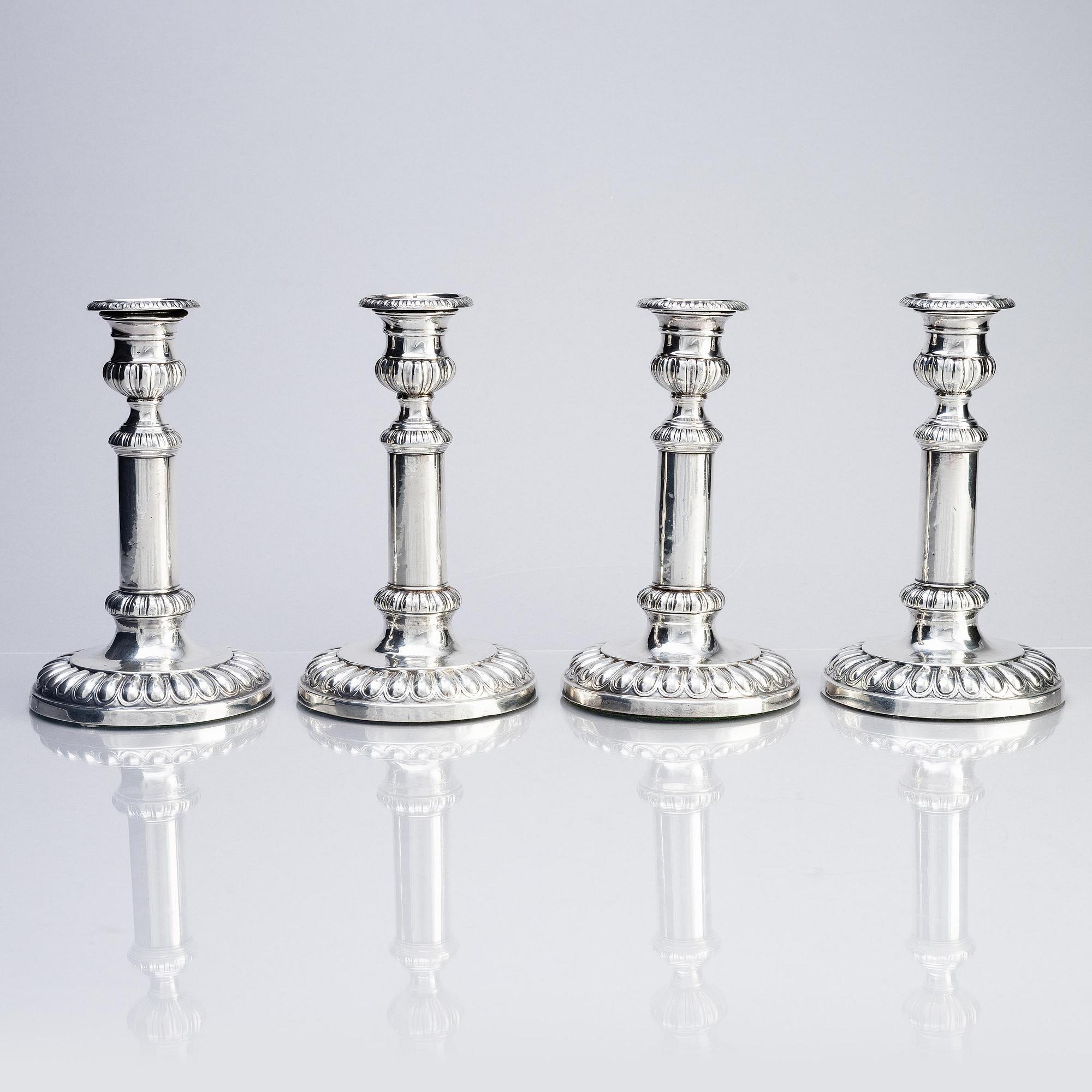 Four English silver candlesticks, marks of John Roberts & Co, Sheffield 1808.
