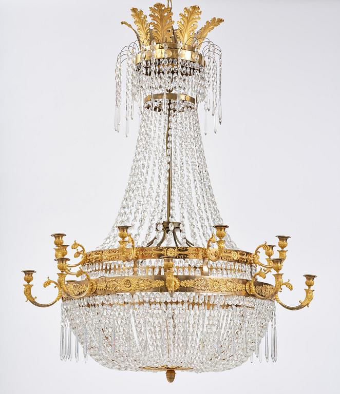 An ormolu and cut glass sixteen-branch Empire chandelier, Paris, early 19th century.