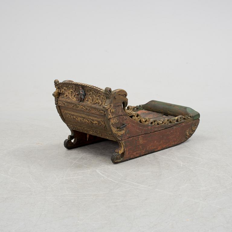 A childrens sleigh middle european dated 1709.