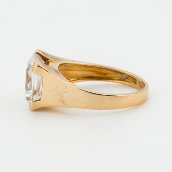 A synthetic white spinel, 18K gold.