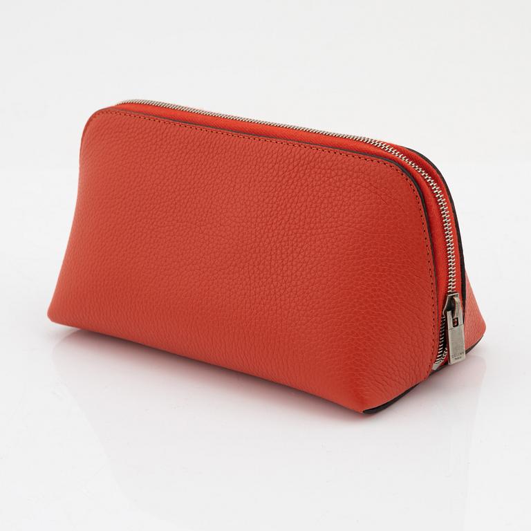 Céline, A cosmetic pouch in bright red leather.