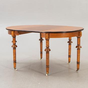 A Neo Renaissance dining table around 1900.